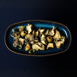 Marinated rapani with olives and peppers in olive oil